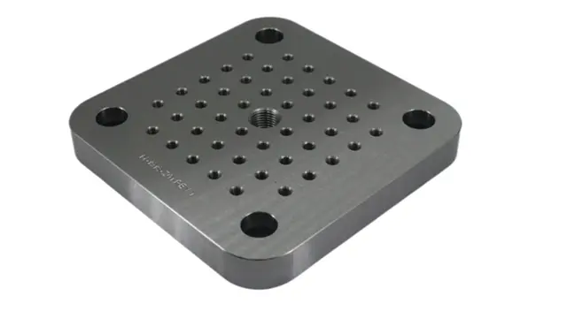 Precision machined metal fixture plate for life science applications.