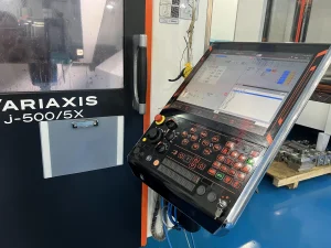 Multi-axis CNC milling machine machining a metal component