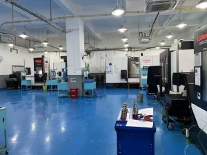 CNC machining shop floor with multiple machines showing production capacity