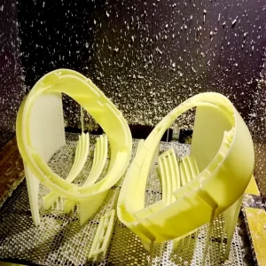 SLA stereolithography 3D printer curing a resin part layer-by-layer with a laser