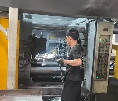 High pressure die casting machine producing aluminum automotive part