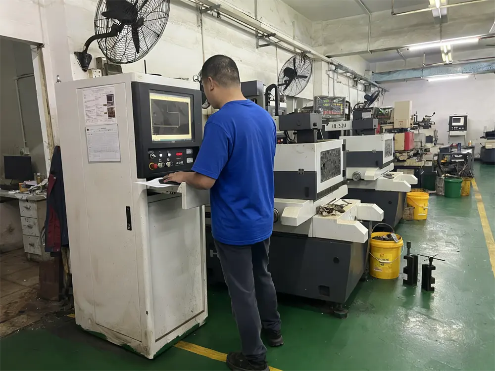 Overview diagram of the Electrical Discharge Machining process showing electrode, sparks, and dielectric fluid.