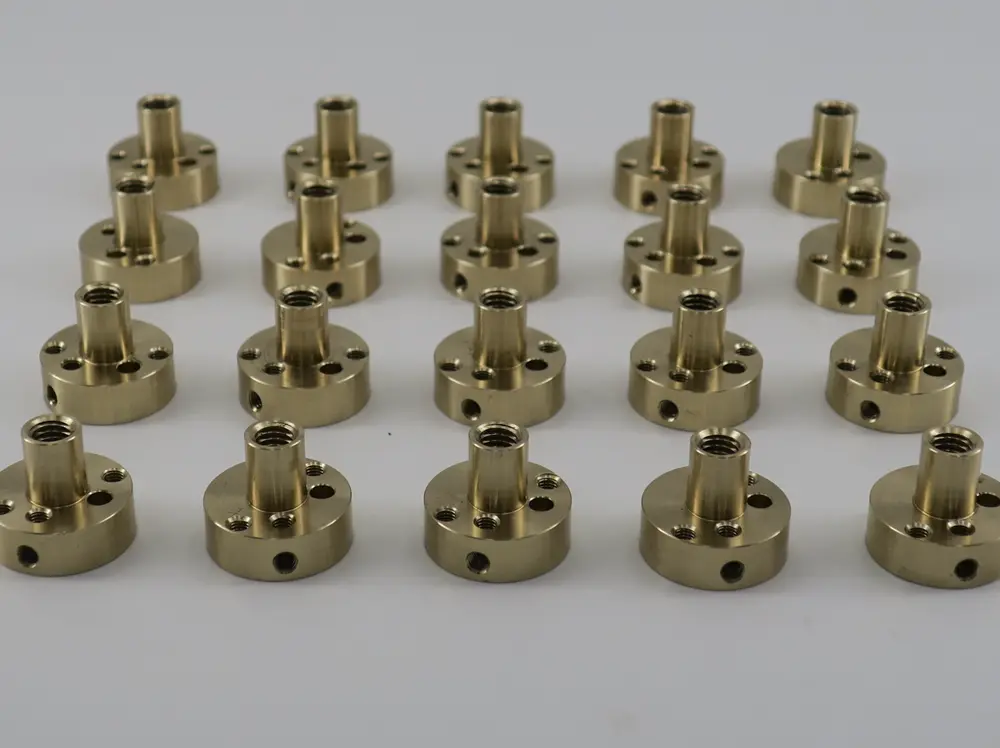 Brass components including valves, fittings, gears, and musical instruments.