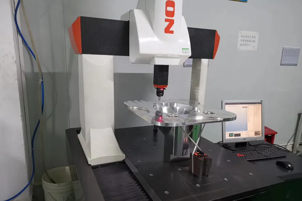 coordinate measuring machine inspecting precision part