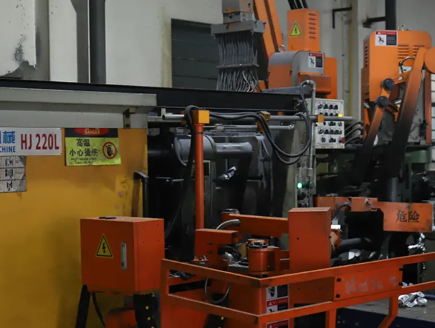 High-pressure die casting press closing on a steel die during production