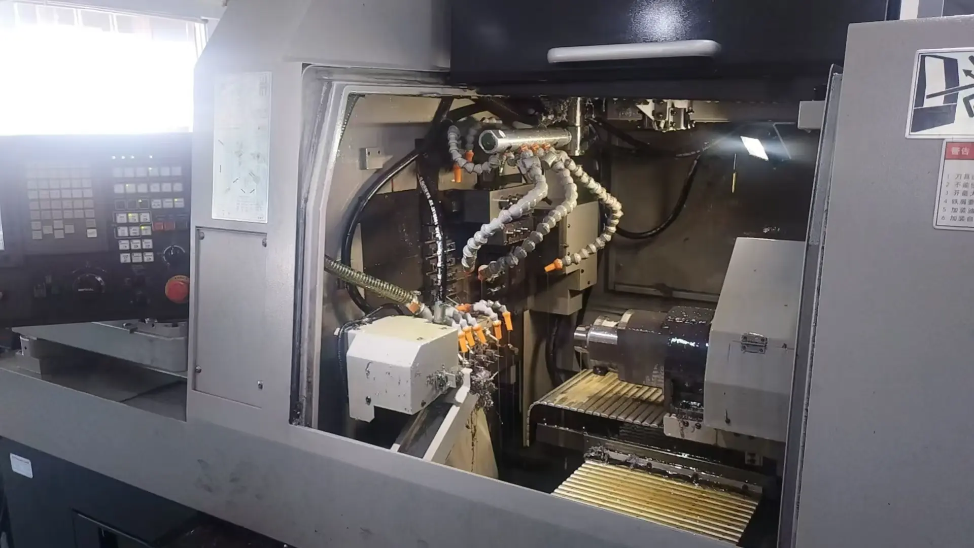 Modern multi-axis CNC Swiss lathe machine producing high-precision miniature metal parts