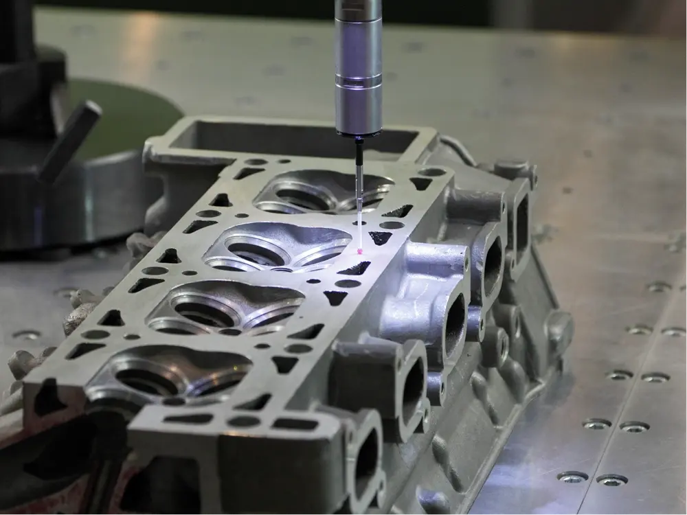 Molten metal being poured into a mold during the industrial casting process