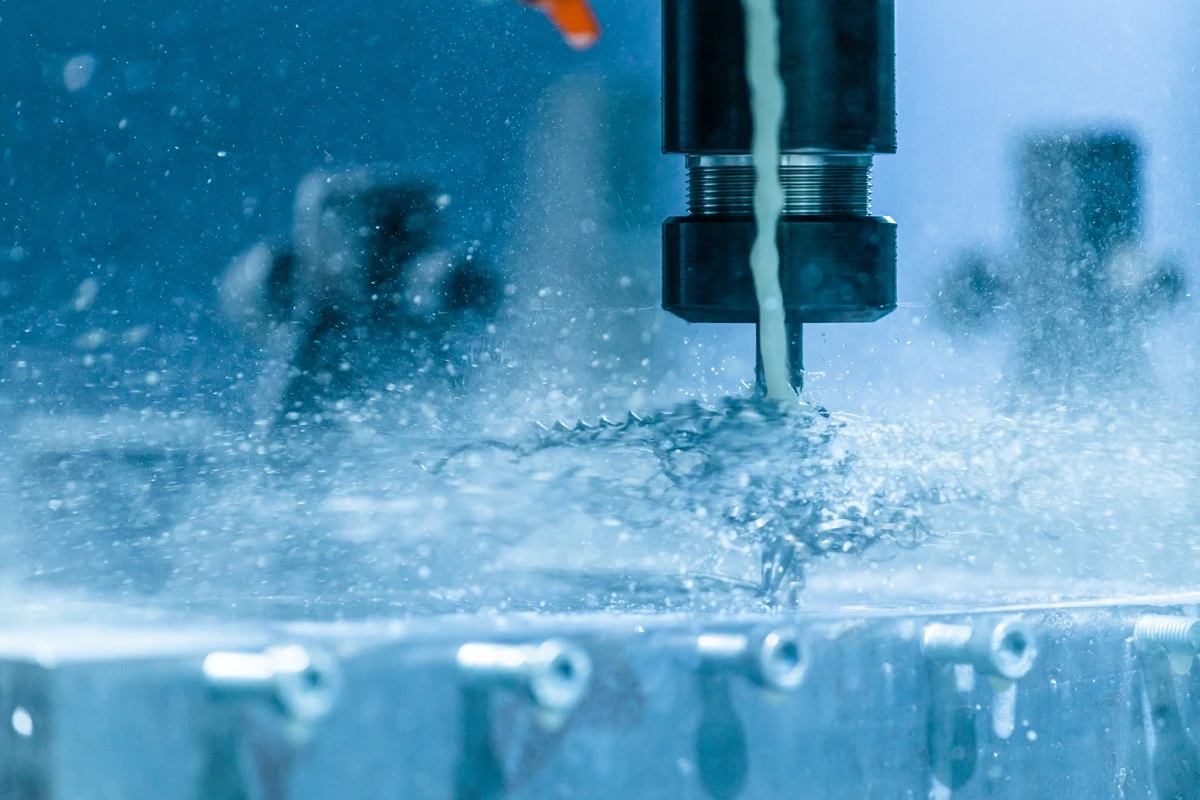 CNC cutting tool milling Invar alloy, demonstrating the long stringy chips and gummy machinability challenges