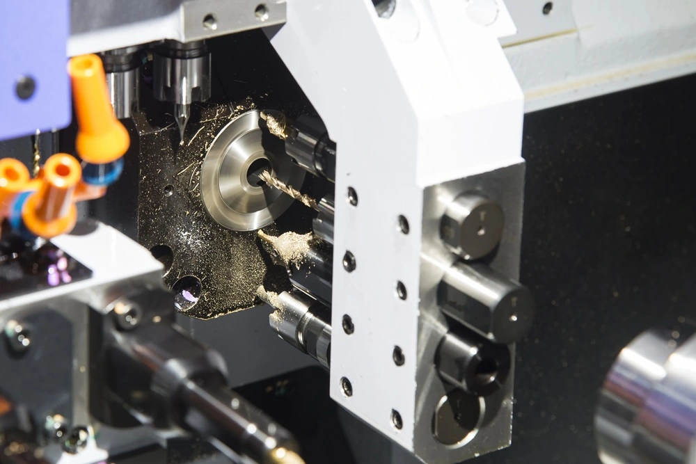 Close-up of a Swiss CNC machining center cutting a precision metal part