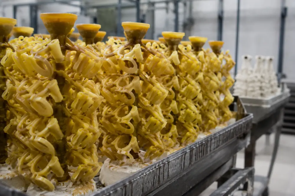 Wax patterns assembled on a sprue tree for complex investment casting parts