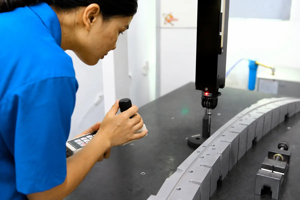 CMM probe measuring CNC machined aluminum part