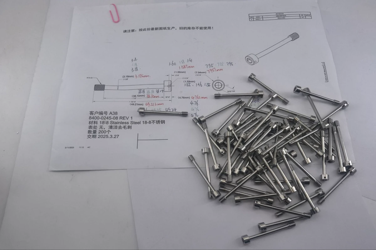 Actual 18 8 stainless steel  10 32 captive panel screw shown with customer engineering drawin