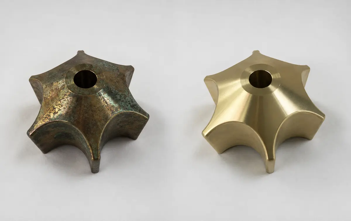 Before and after restoration of a brasscomponent