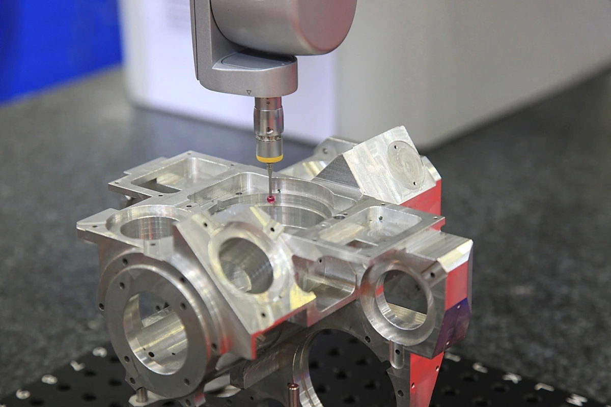 CMM probe scanning a complex-shaped medical device component