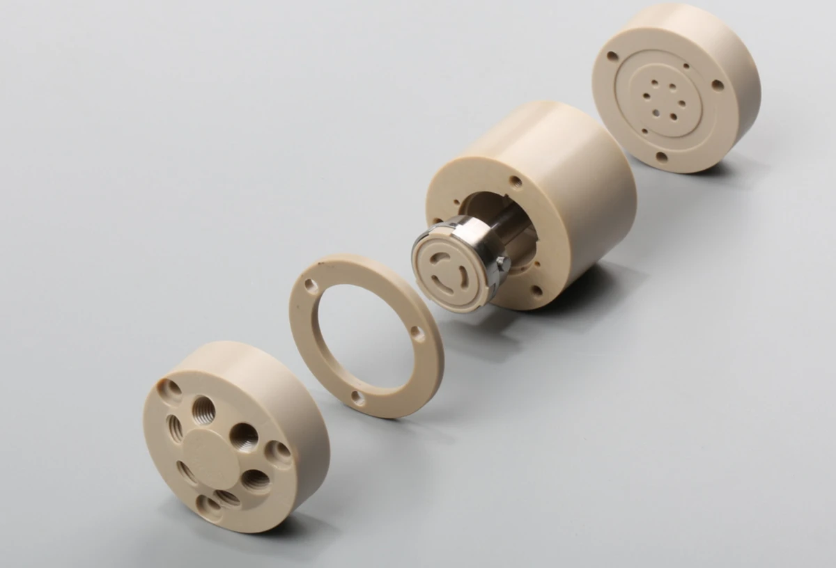 CNC machined PEEK cylindrical parts with threaded holes and precision assembly features