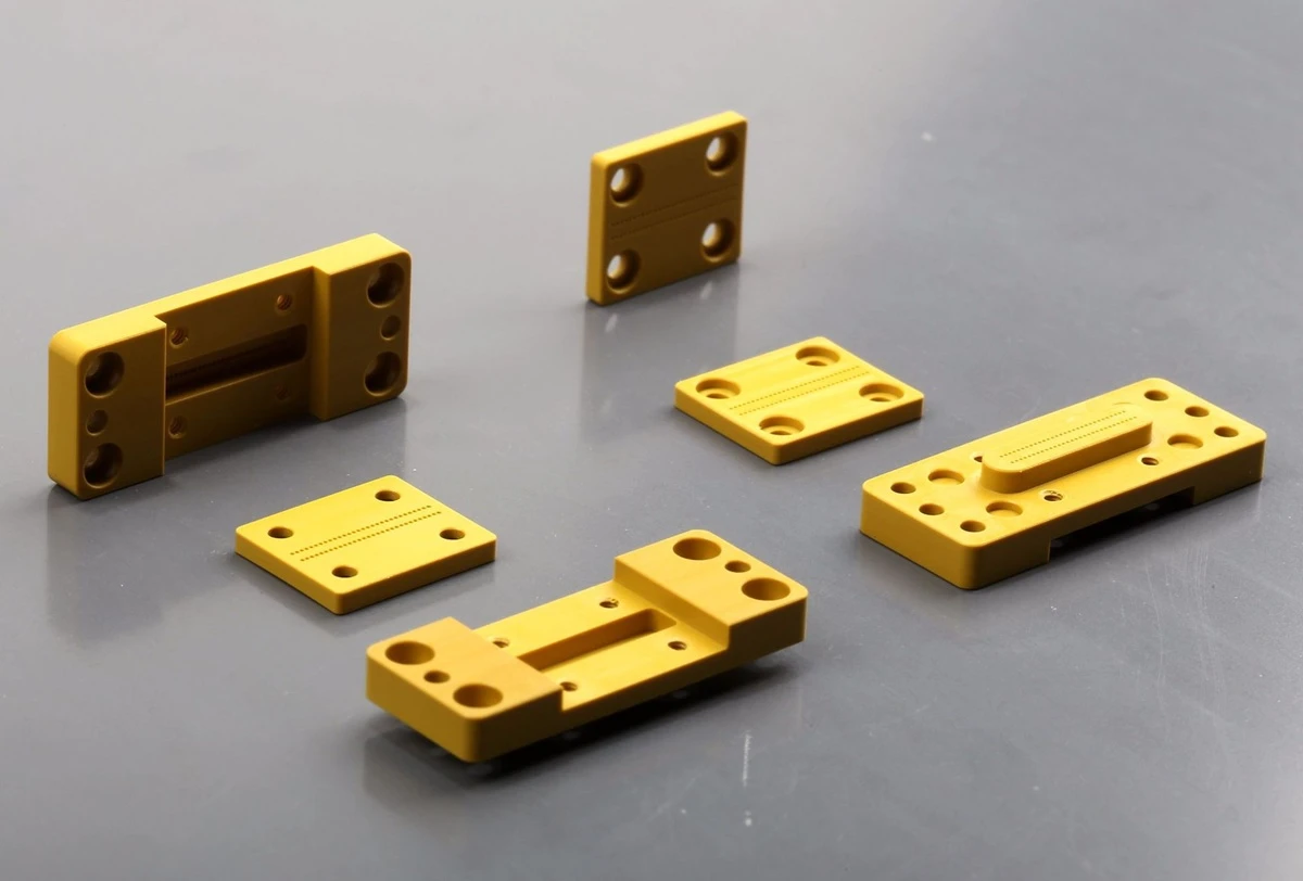 CNC machined Torlon PAI fixture plates with precision holes pockets slots and alignment features