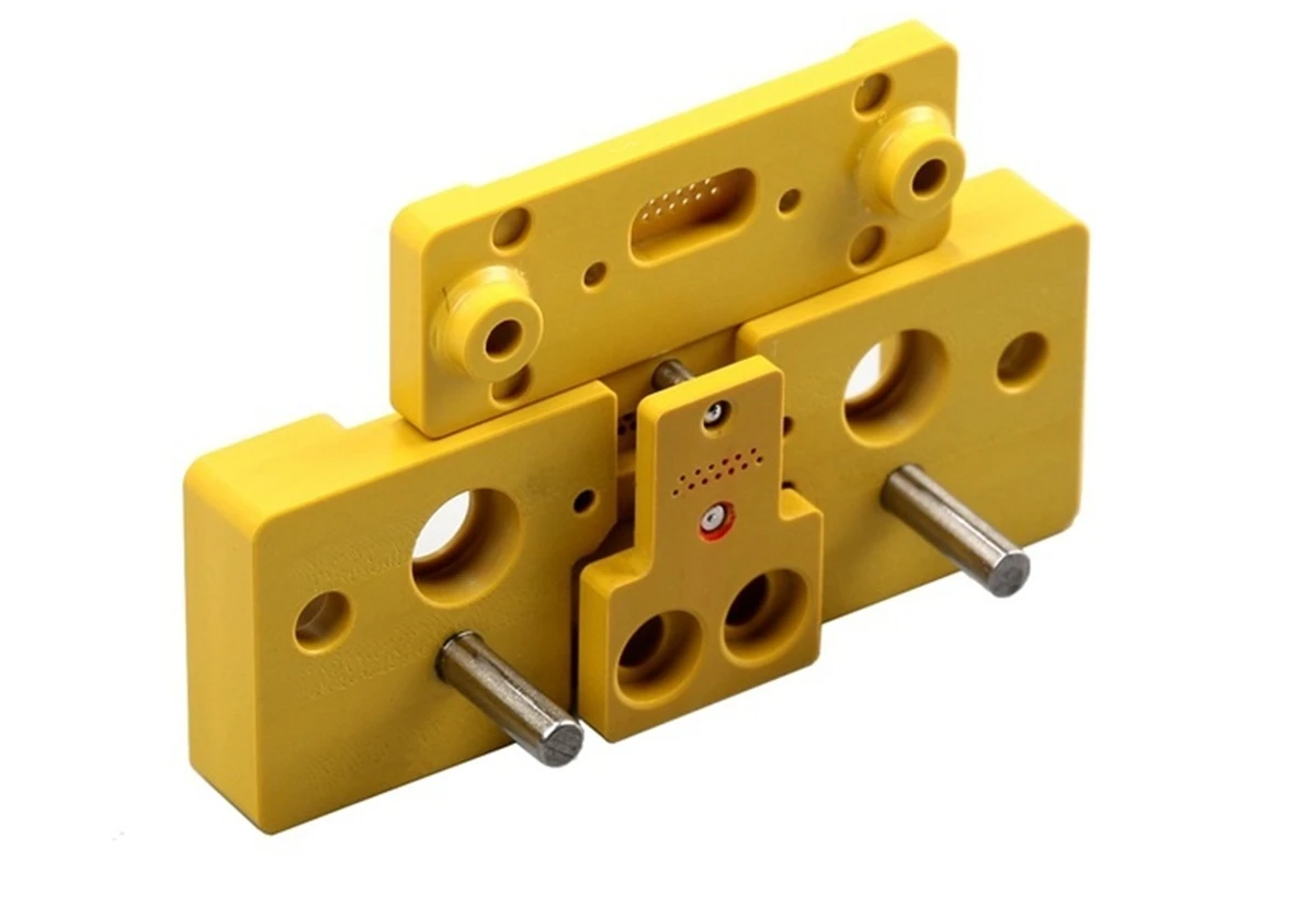 CNC machined Torlon PAI precision positioning and test fixture components