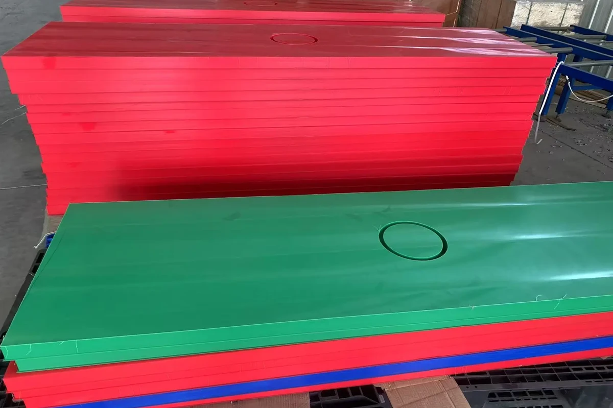 Colored UHMW polyethylene sheet stock in red green and blue for custom machined components