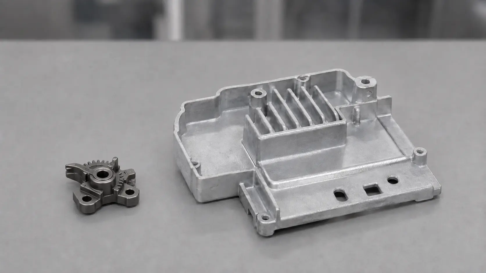 MIM part vs aluminum die-cast housing