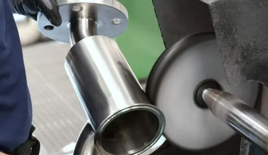 Polishing a curved stainless steel component