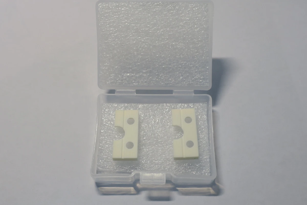 Precision ceramic parts individually cushioned in a compartmented tray for impact protection