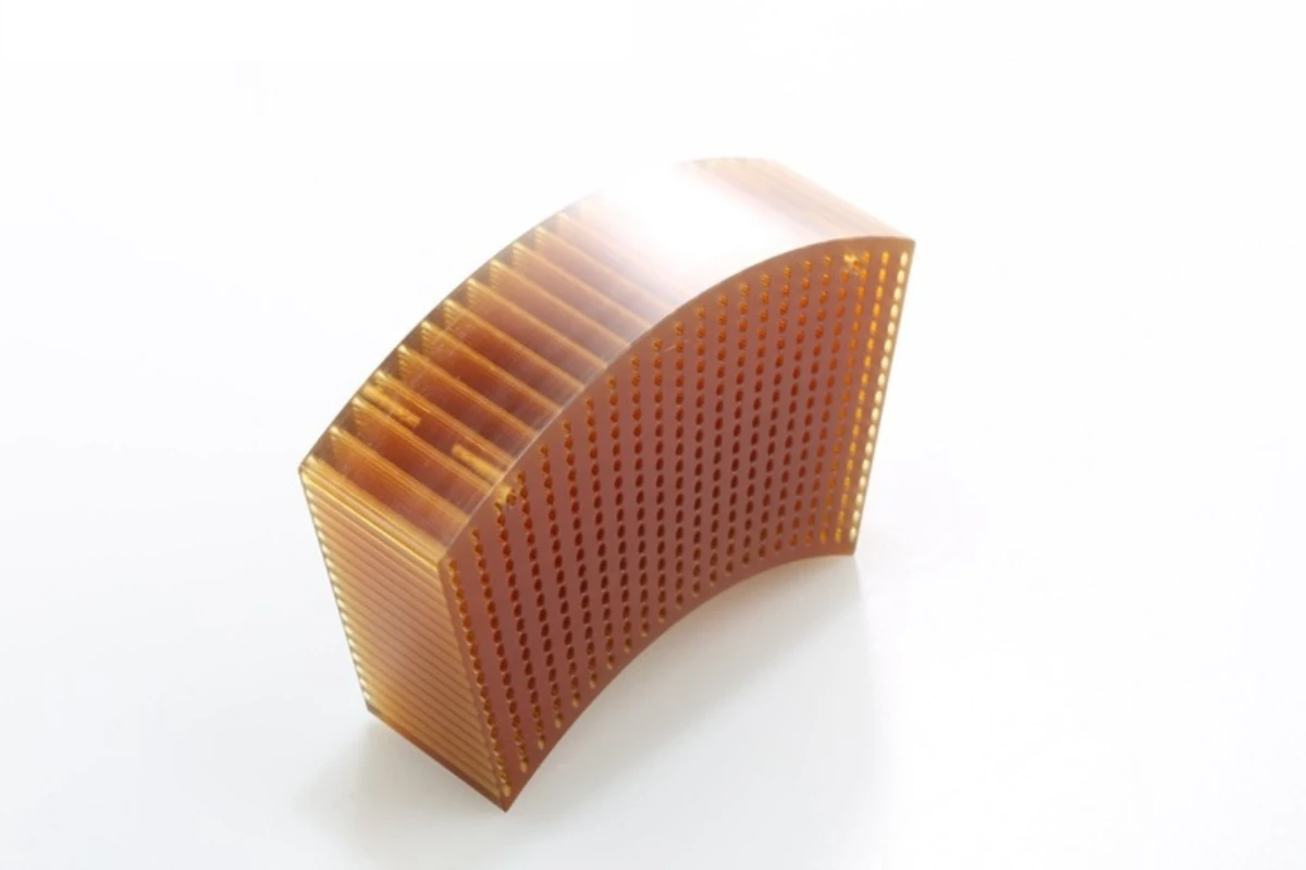 Precision micro hole machining on amber PEI component