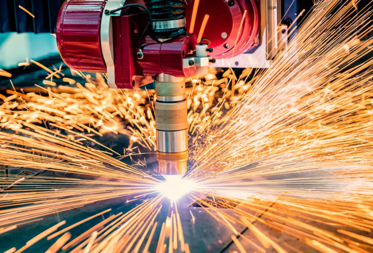 CNC laser cutting sheet metal with sparks