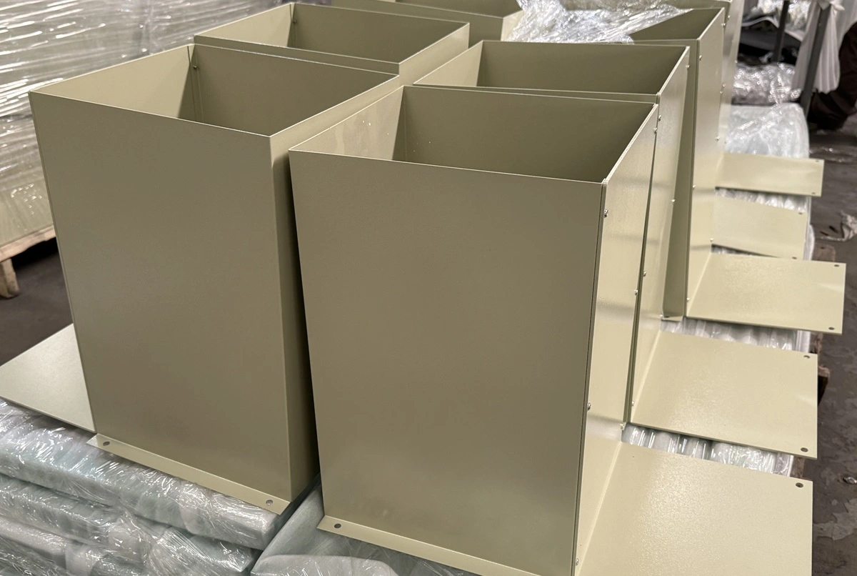Batch of beige powder coated sheet metal boxes