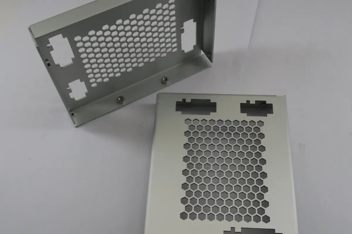 Formed sheet metal enclosure panels and cutouts