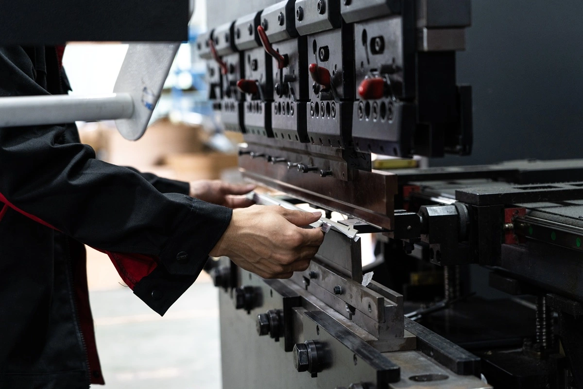 Press brake bending a sheet metal component