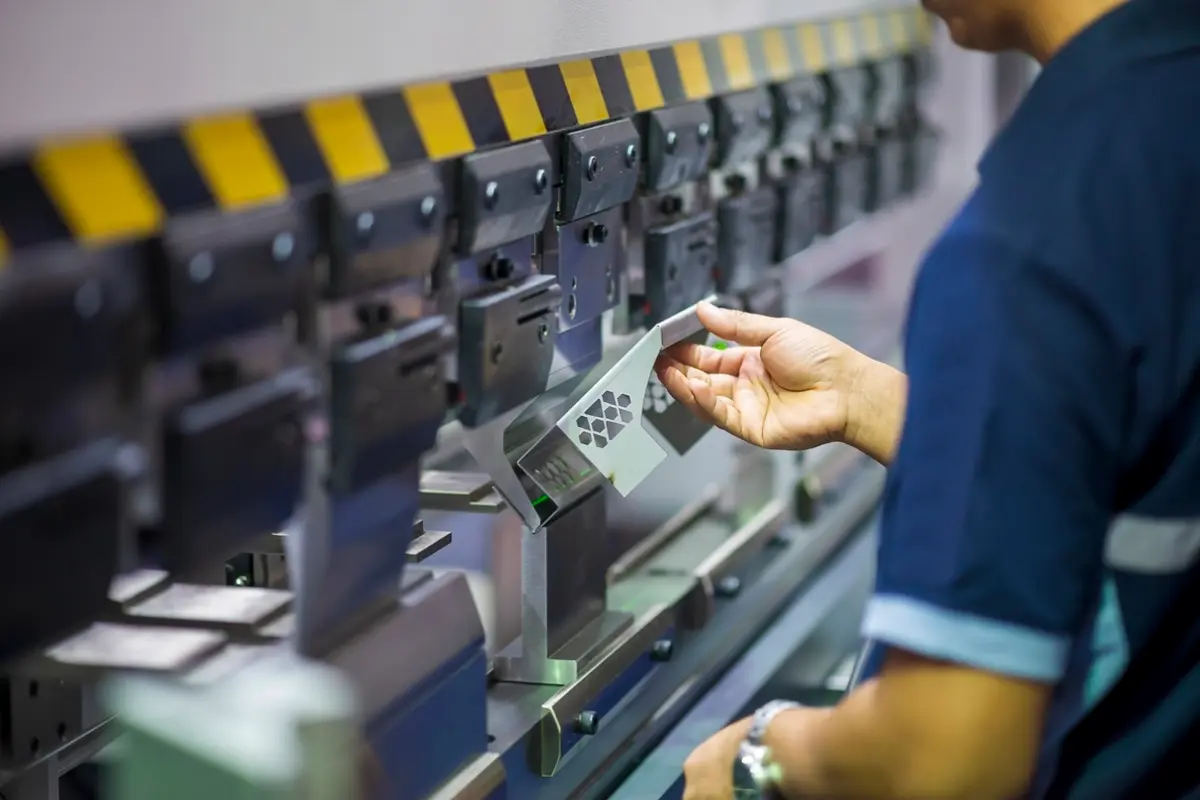 Press brake forming a sheet metal enclosure