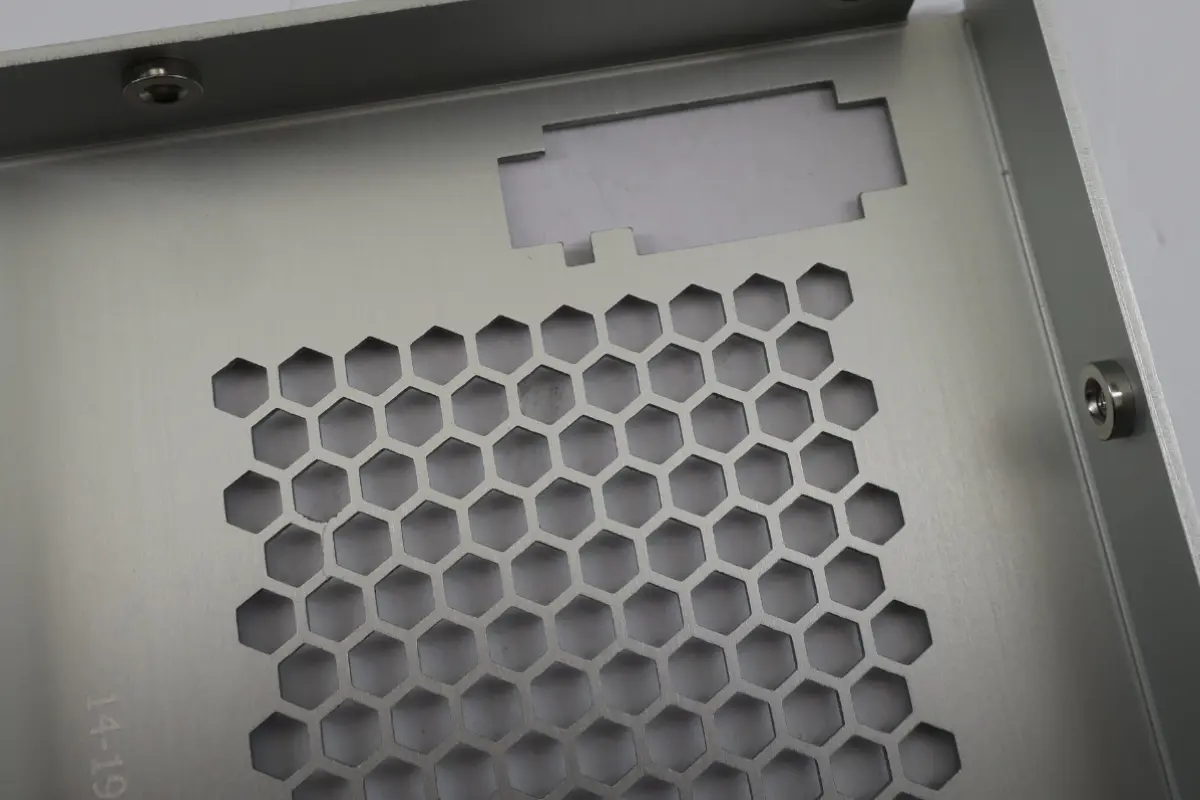 Sheet metal panel with ventilation and connector cutouts